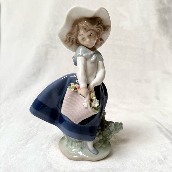 Lladro Porceline Figurine  Girl in Blue and White dress.